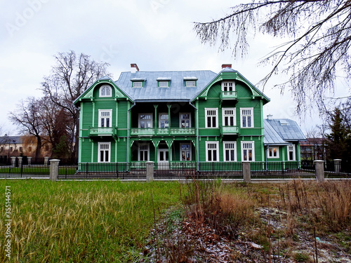 a wooden storied residential building built at the turn of the 19th and 20th centuries called a green villa in the village of Różanystok in Podlasie, Poland