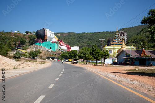 Win Sein Tawya, the largest reclining statue of Buddha in the world. Picture taken on the way to the statue, on the road. Mawlamyine, Myanmar, Burma, Southeast Asia photo