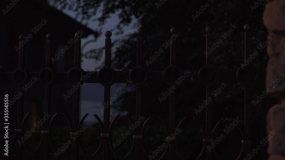 fence in front of a mansion