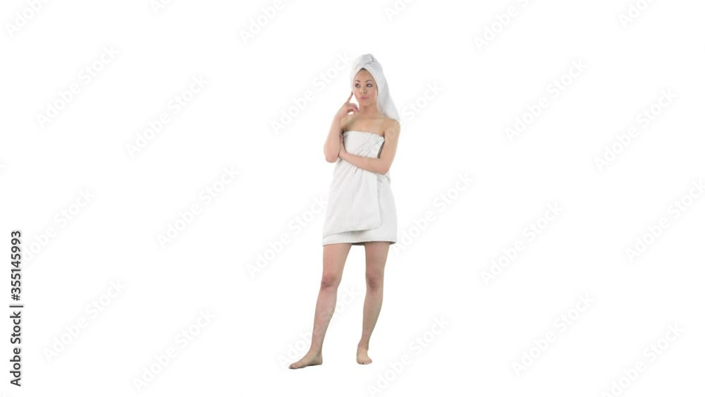 Young woman in bath towel thinking looking around and having idea or inspiration isolated on solid white background. Young woman in bath towel thinking looking around and having idea or inspiration isolated on solid white background.