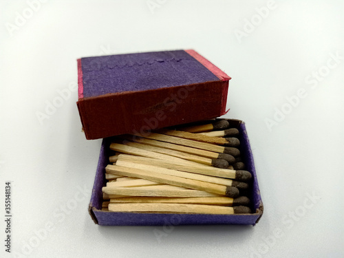 Half opened blank matchbox with matches inside isolated on white