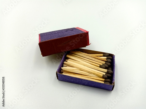 matches in box, Half opened blank matchbox with matches inside isolated on white