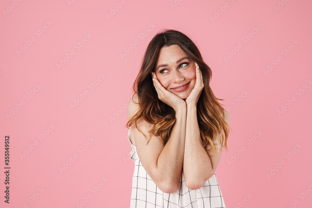 Image of happy beautiful woman smiling and looking aside Image of happy beautiful woman smiling and looking aside