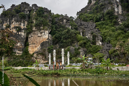 Small family cemetery between the rice cultivation typical from the Vietnamese culture. Concept of nature. Long shot.