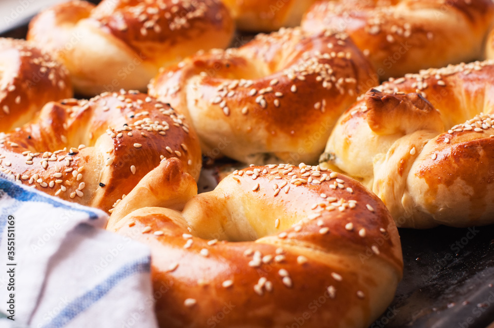 Homemade yeasty buns with cheese and herbs.