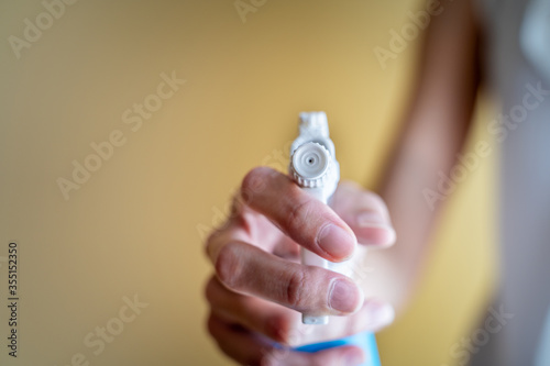 Woman holding a spray