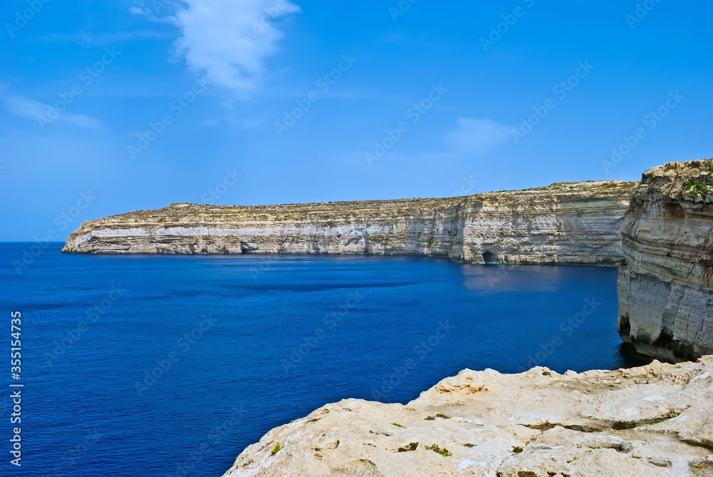 Scenic landscape overlooking the Maditerranean Sea and  rocky coast of Gozo Island, Malta.
