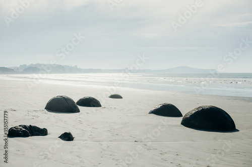 Moeraki Boulders on the Koekohe beach, Eastern coast of New Zealand.