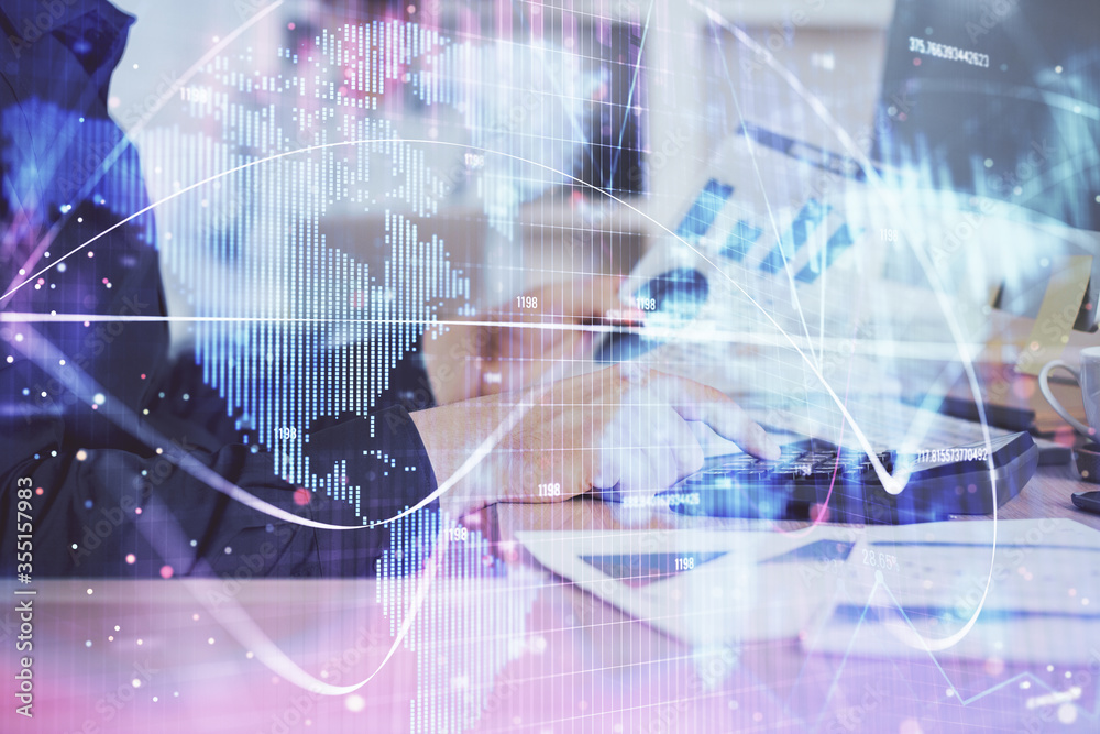Double exposure of businessman working on laptop on background. International business hologram in front. Concept of success. Double exposure of businessman working on laptop on background. International business hologram in front. Concept of success.