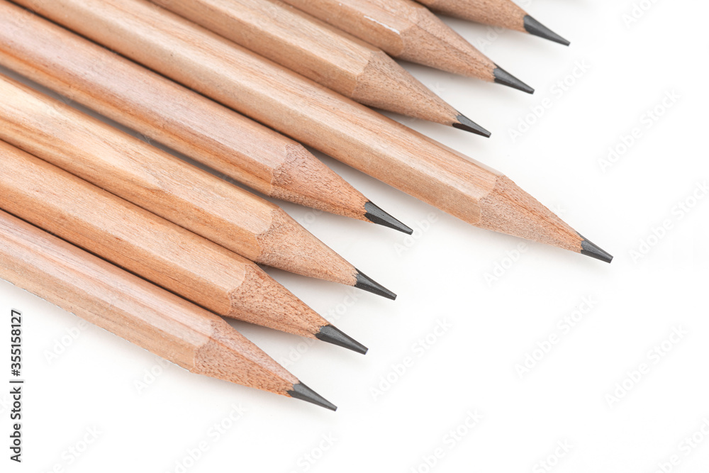 Obraz premium Close-up wooden pencils on the white background.