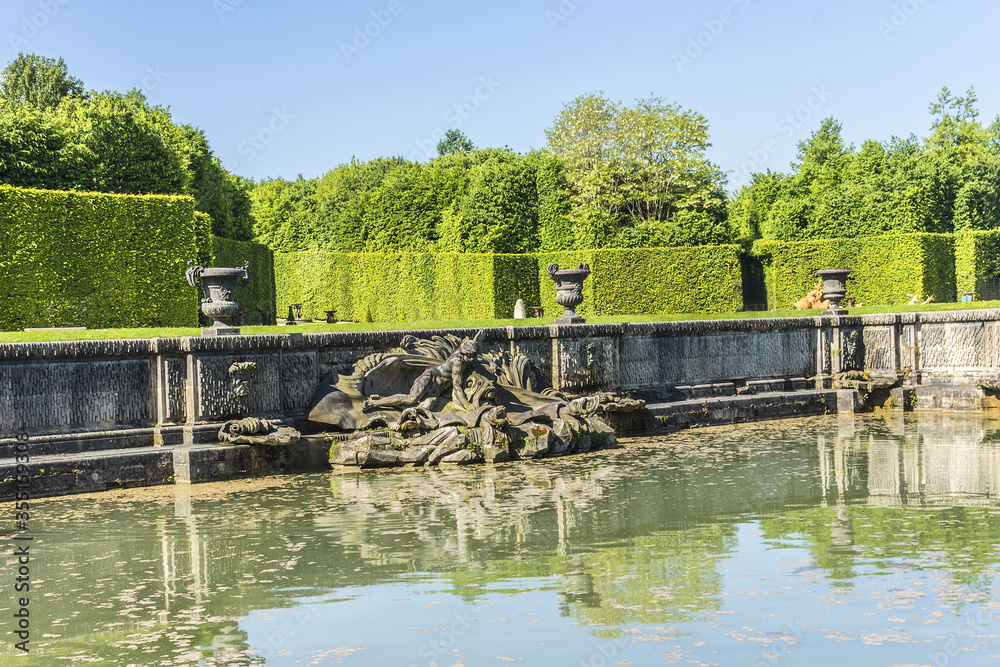Neptune Fountain (1770) in gardens of famous Versailles palace. Palace of Versailles was a royal chateau. It added to UNESCO list of World Heritage Sites. Versailles, Paris, France. Neptune Fountain (1770) in gardens of famous Versailles palace. Palace of Versailles was a royal chateau. It added to UNESCO list of World Heritage Sites. Versailles, Paris, France.