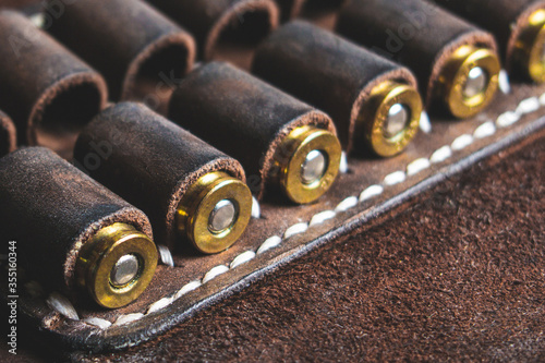 cartridges for 10 x 22 caliber pistol in brown genuine leather bandolier photo