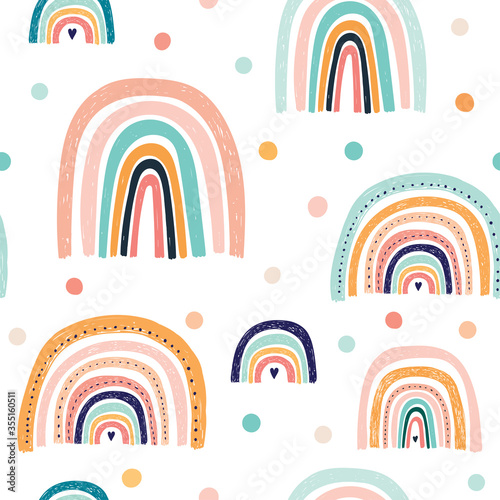 Trendy seamless baby pattern wit hand drawn rainbows. Vector illustrations. Summer colorful pattern design. Funny rainbows for Party decoration 