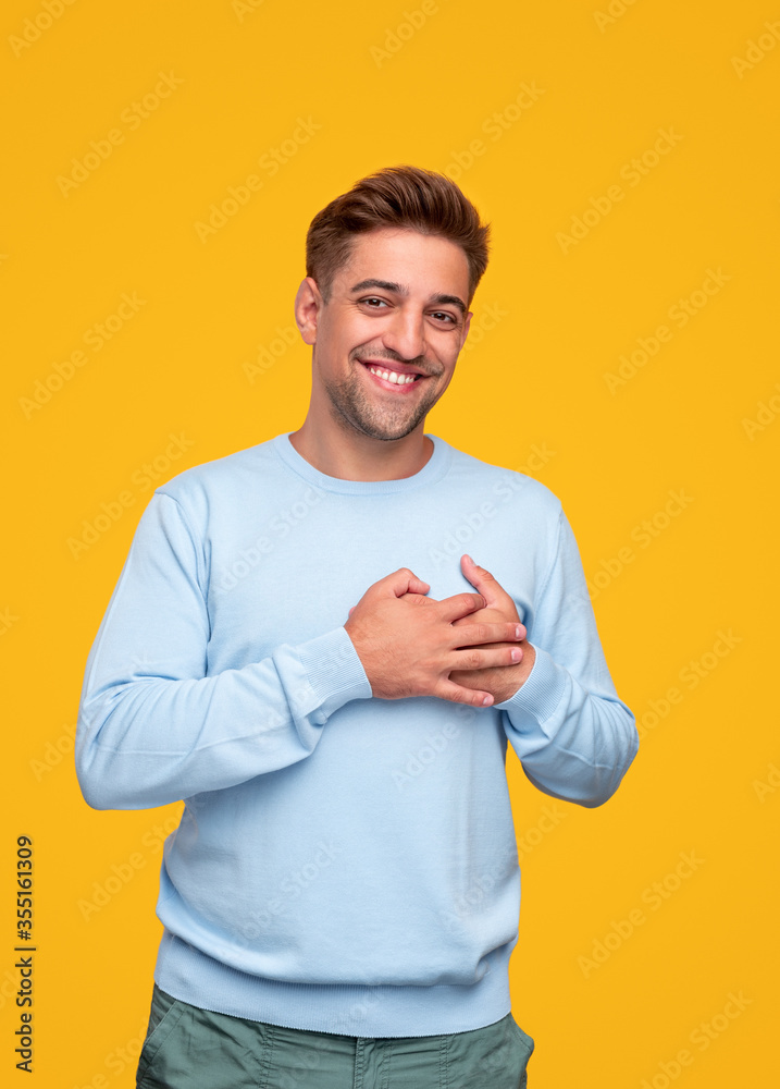 Pleased guy with hands on chest Pleased guy with hands on chest