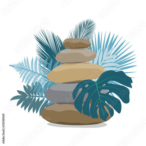 zen pebbles surrounded by tropical leaves