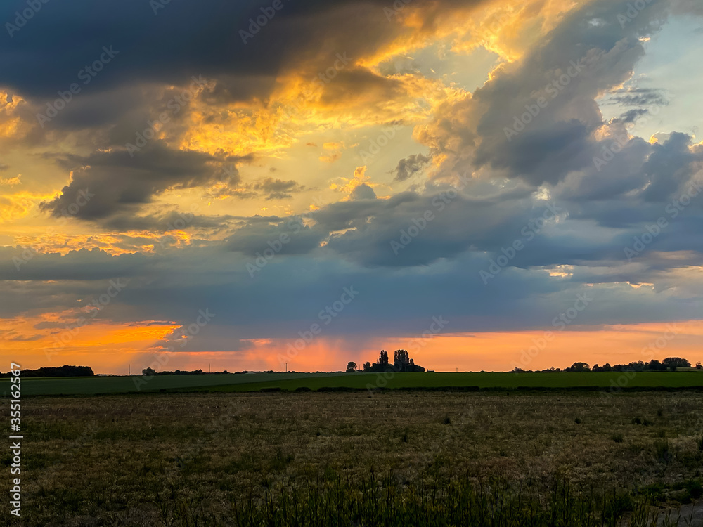 Fototapeta premium clouds over the fields