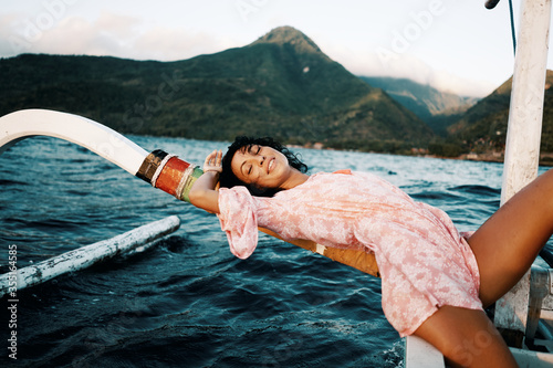 Woman on the boat of fisherman yahting sailing photo