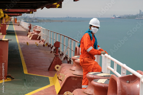 seaman covid-19 main deck and mooring equipment of cargo ship, vessel photo