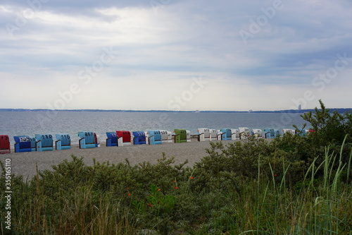 Panoramalandschaft der Ostsee bei Sierksdorf mit bunten Strandkörben photo