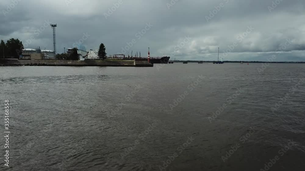 4K aerial cloudy day drone video of beautiful Gulf of Finland bay view of commercial port entrance fairway channel area with Leningrad city sign, Kanonerskiy Island, St.Petersburg, Russia 4K aerial cloudy day drone video of beautiful Gulf of Finland bay view of commercial port entrance fairway channel area with Leningrad city sign, Kanonerskiy Island, St.Petersburg, Russia