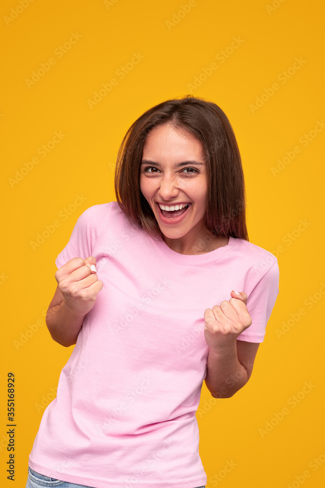 Excited young woman celebrating victory Excited young woman celebrating victory