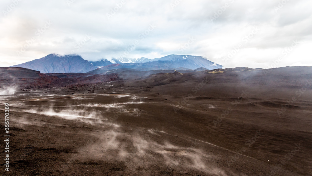 Volcanic steaming land near active volcano Tolbachik, Kamchatka, Russia