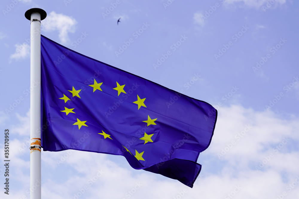 Blue europe stars european flag of EU floats in the wind