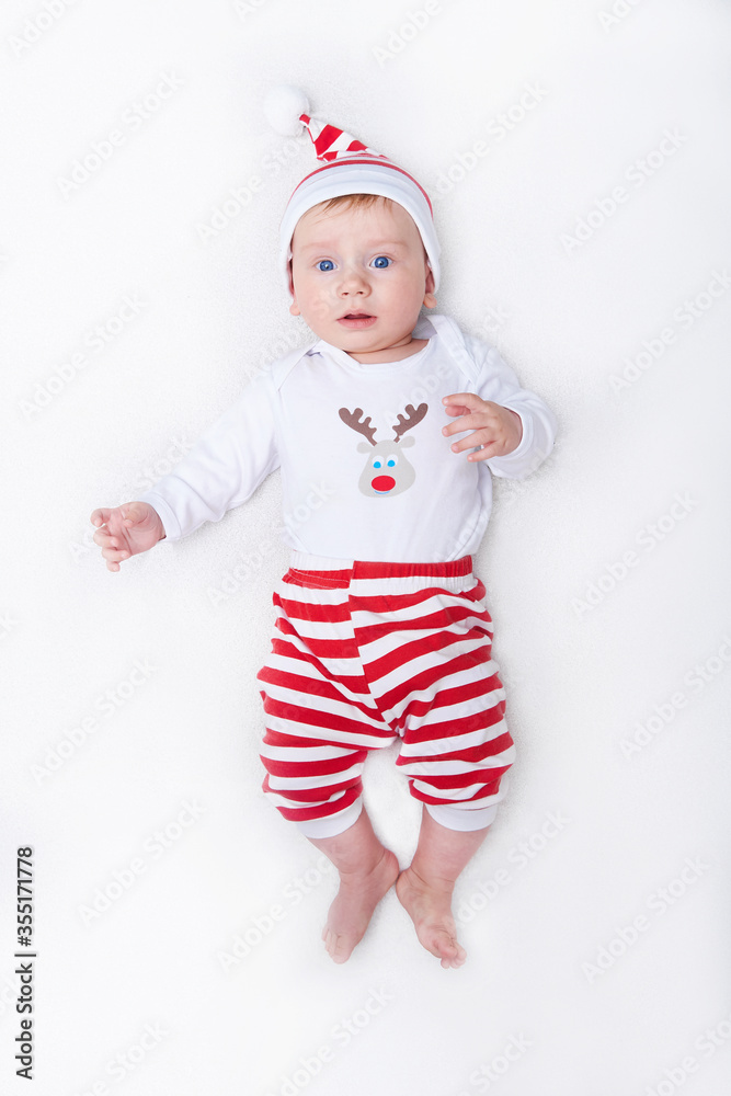 Cute baby in santa costume New Year and Christmas card Copy space