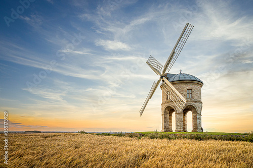 Chesterton windmill in the countryside with a summer sunset
