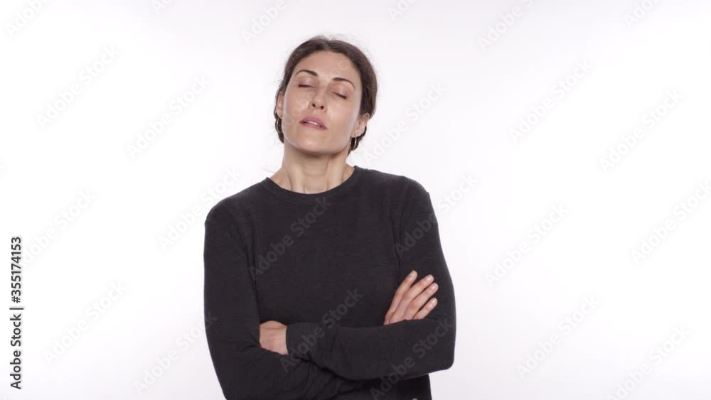 A beautiful middle aged woman of Spanish descent gets angry and crossed her arms disapprovingly A beautiful middle aged woman of Spanish descent gets angry and crossed her arms disapprovingly