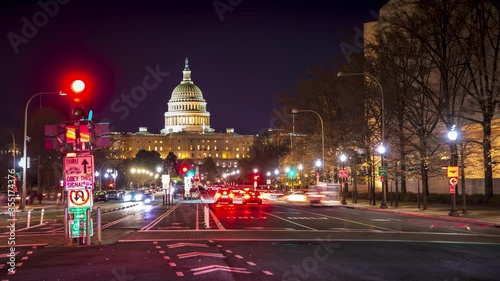 Time-lapse of evening rush hour traffic racing around the United States Capitol Building in Washington, DC.