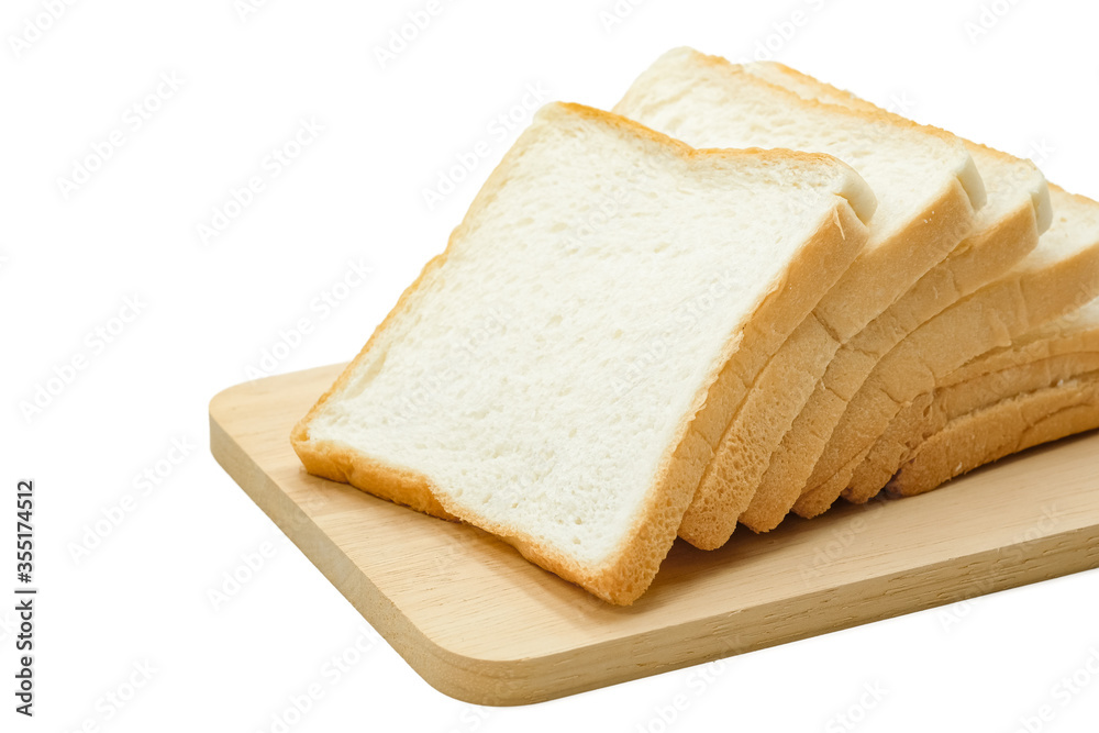 Close-up of slice bread on wooden board placed on white background.