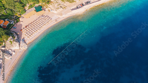 Beautiful beach with crystal clear water in the Mediterranean. Aerial view. Sunny day.
