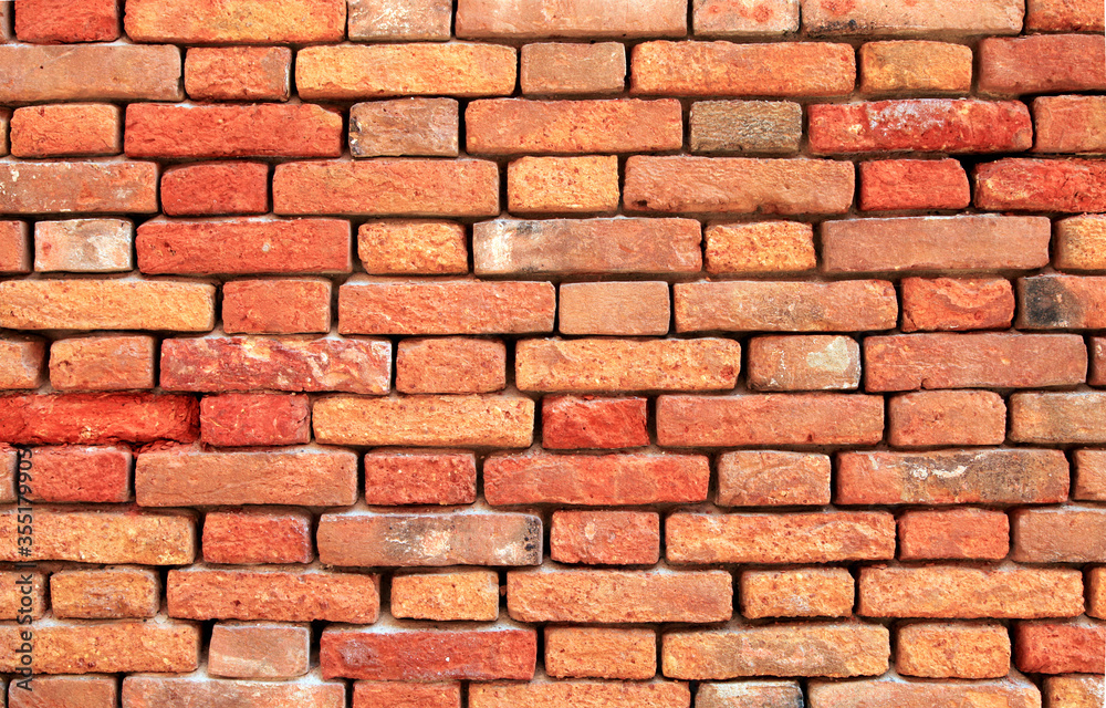Naklejka premium Old red brick wall background in Venice, Italy.