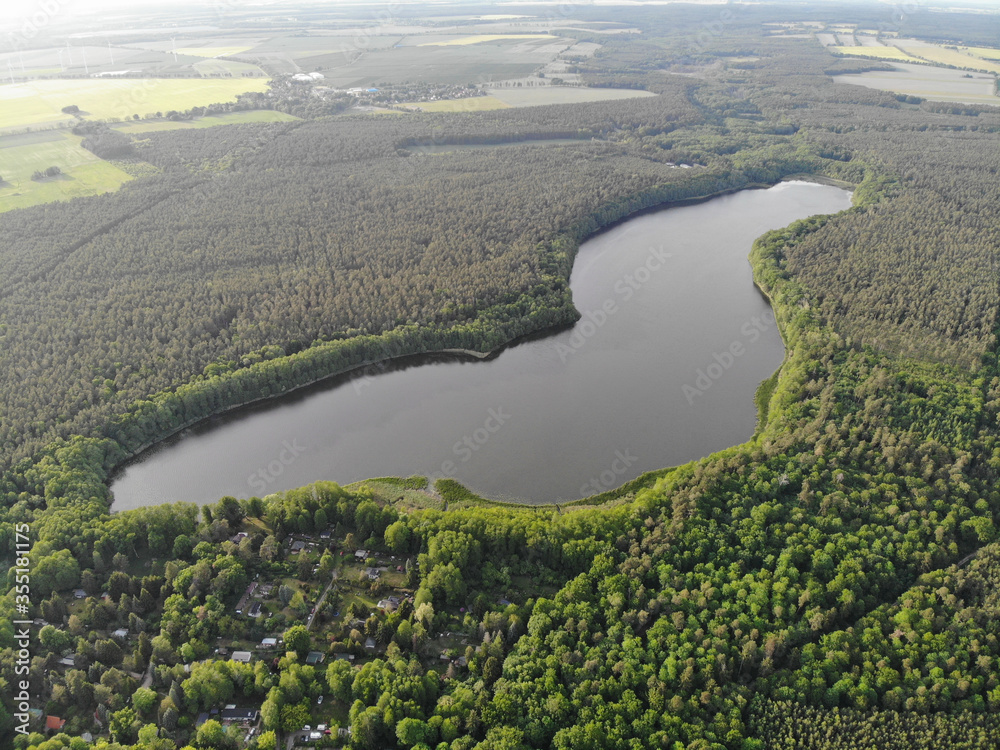 Aerial view of lake Fängersee near Strausberg (Brandenburg). Surrounding villages are Hirschfelde, Altlandsberg and Petershagen-Eggersdorf. The lake is located in the catchment area of Strausberg
