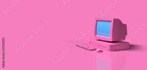 Vintage old computer desktop on pink background