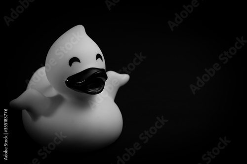 Closeup of a rubber duck toy in black & white