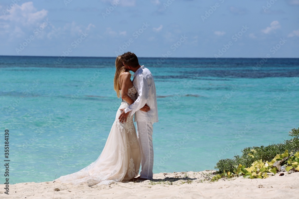 bride and groom on beach bride and groom on beach