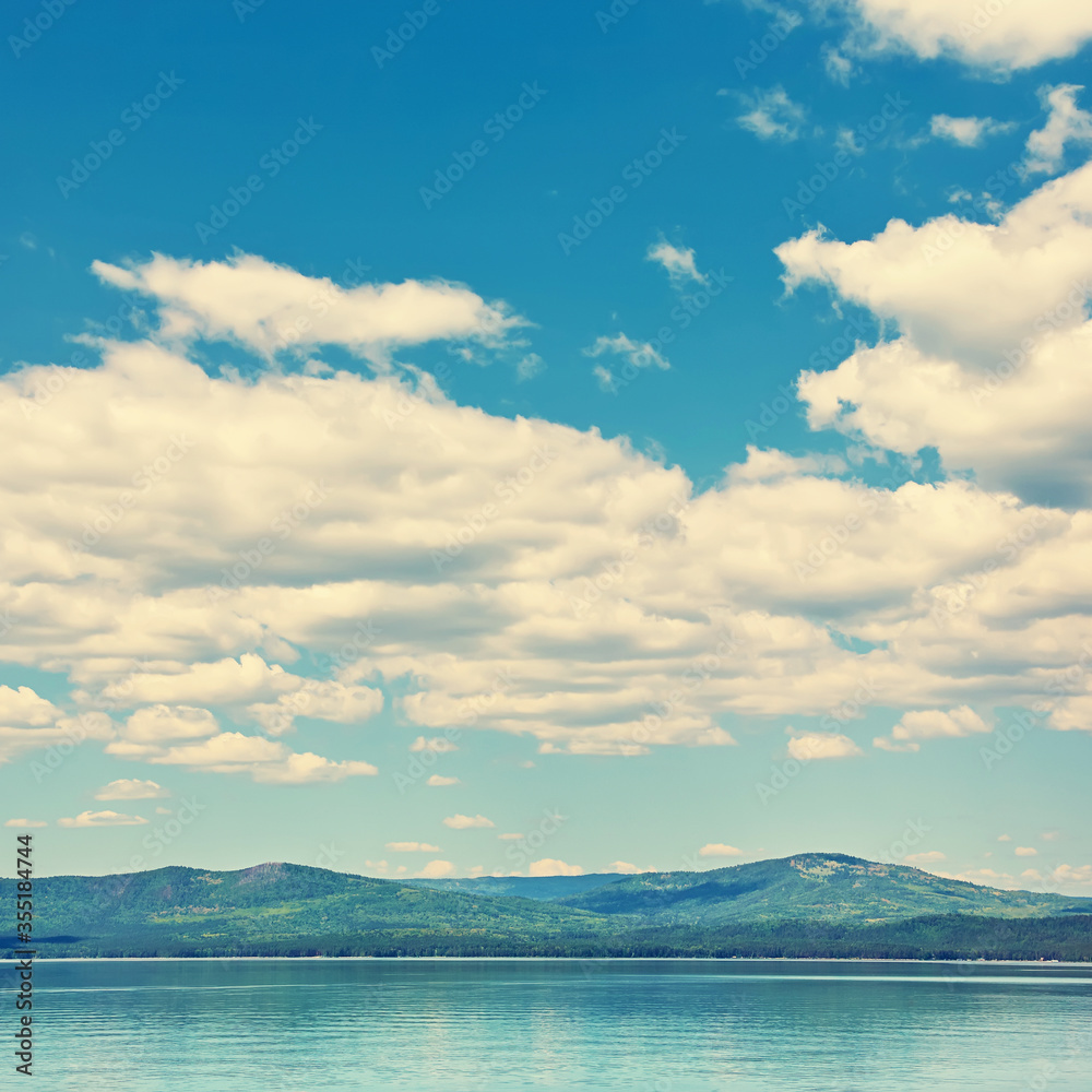 scenic mountain lake with sky and clouds. nature background.