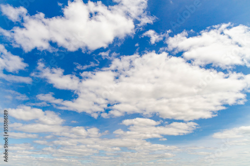 Bright blue sky with white clouds.