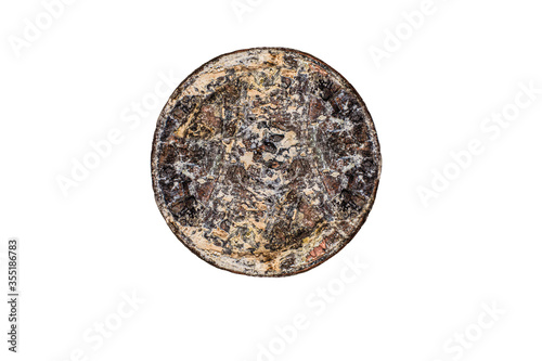 Corroded rusty penny on isolated white background