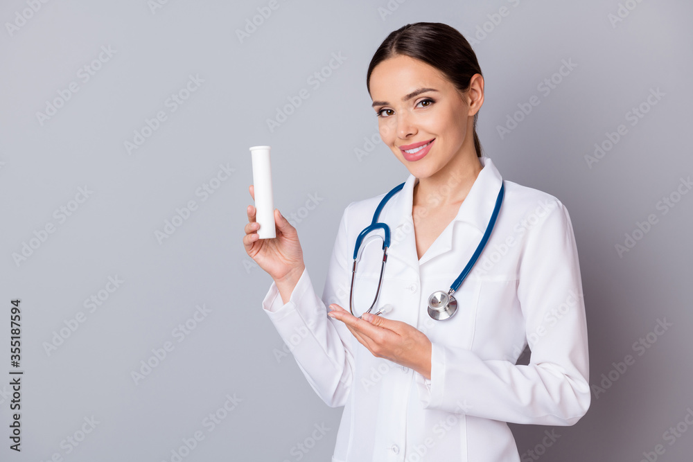 Photo of cheerful family doc lady professional advising patients vitamins complex bottle good quality swiss product wear medical uniform lab coat stethoscope isolated grey background Photo of cheerful family doc lady professional advising patients vitamins complex bottle good quality swiss product wear medical uniform lab coat stethoscope isolated grey background