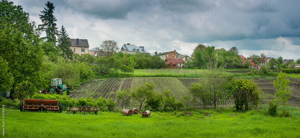 rural landscape with ancient rural stock for field cultivation