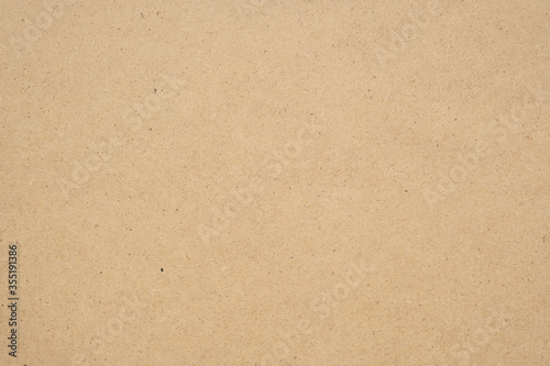 Texture of brown craft paper or kraft paper background.