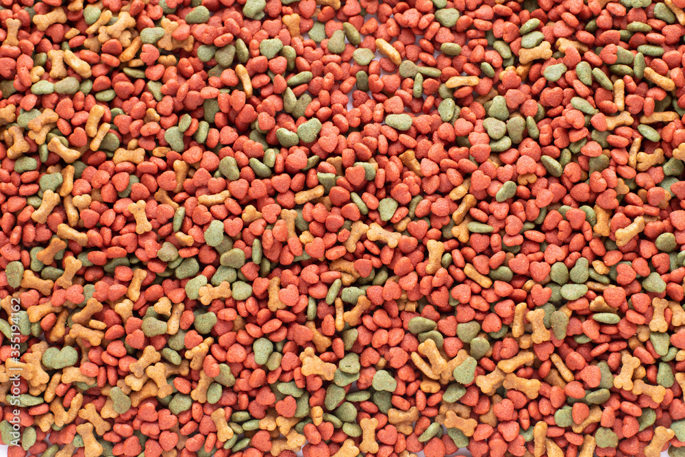 Colorful Dried dog food background. Top view grain pet food banner background with copy space of test design. Above or Top view. food panorama banner.. Colorful Dried dog food background. Top view grain pet food banner background with copy space of test design. Above or Top view. food panorama banner..