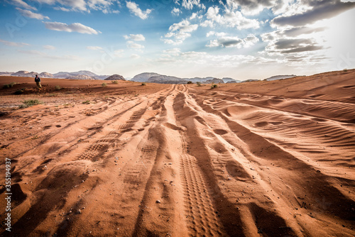 Fototapeta Naklejka Na Ścianę i Meble -  Four Wheel Drive car tire print on sand dune at wadi rum, jordan