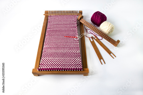 Mini loom is a small weaving gear for hobby. Cotton and shuttle weaving are the important tool.
Weaving by using mini loom is a popular hobby among teenagers.



