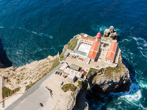 Beautiful lighthouse located on high cliffs of Saint Vincent cape in Algarve, Portugal