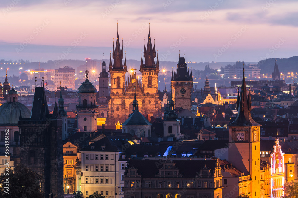 View of Prague and Charles Bridge in the early morning before sunrise. Tourism. Towers of Prague. Czech Republic