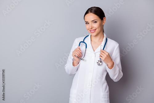 Photo of attractive pretty young family doc experienced skilled professional listen patient complaining good mood friendly wear medical uniform lab coat stethoscope isolated grey background